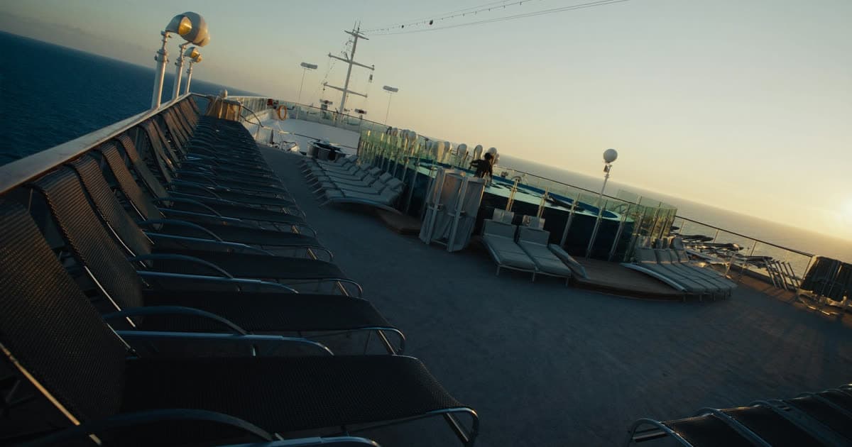 A quiet adults-only cruise ship deck at sunset