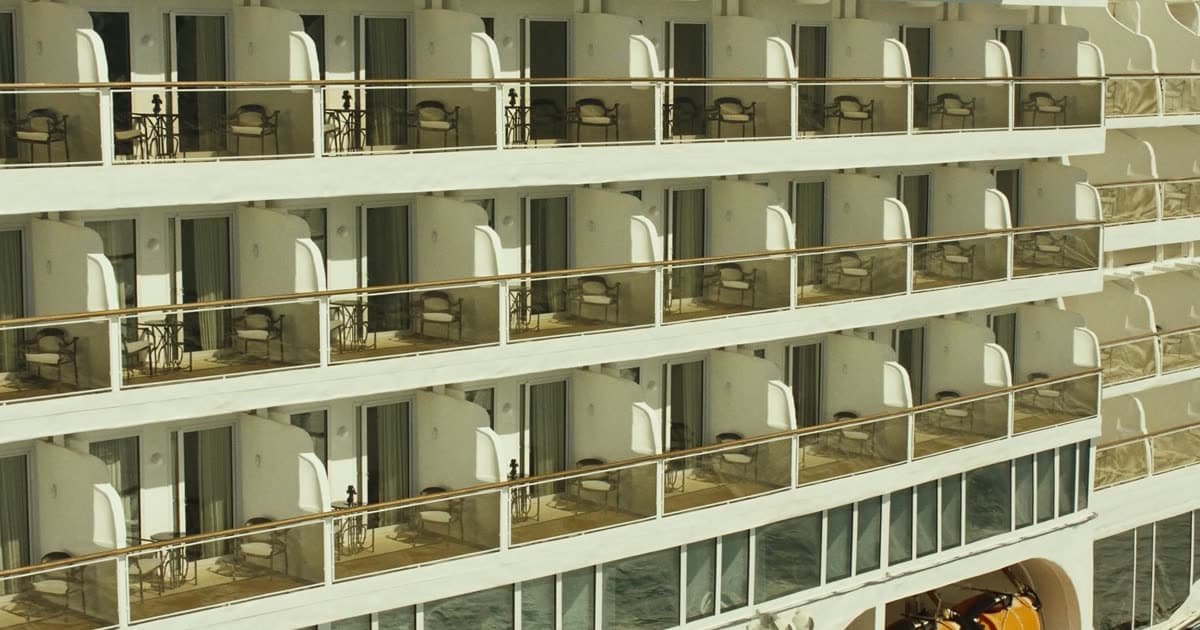 A cruise ship in profile showing cabin decks