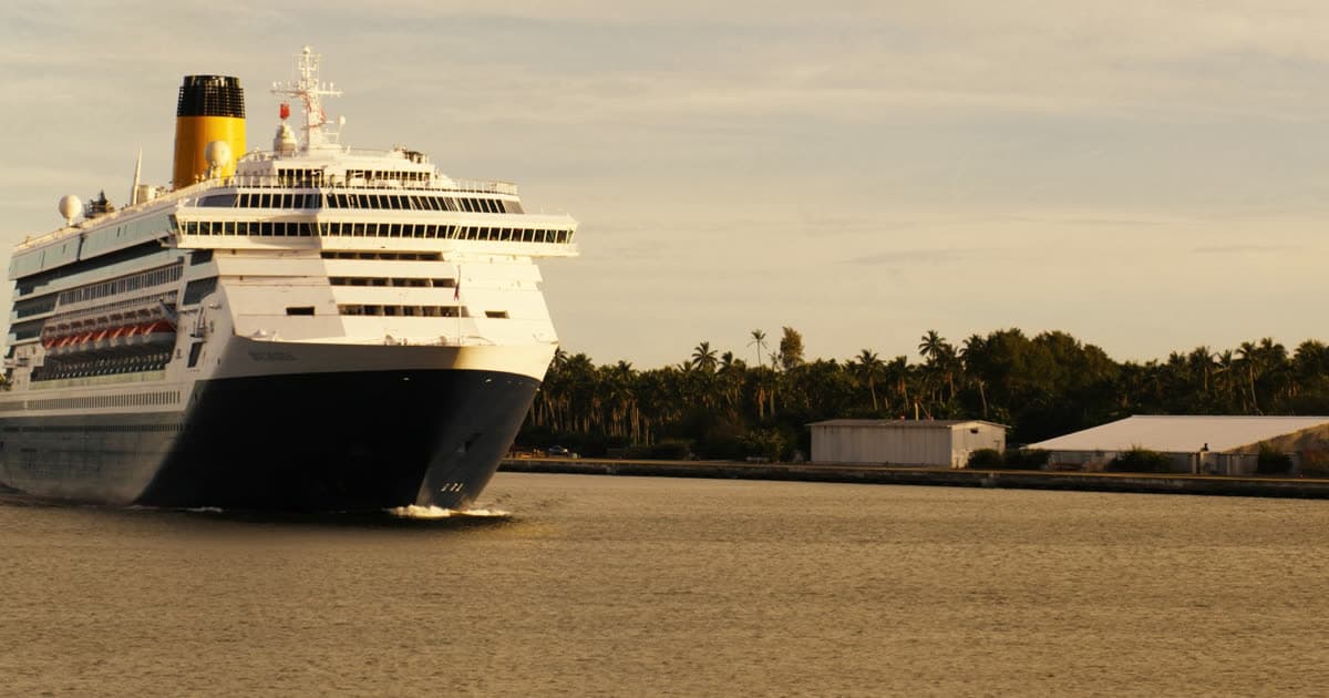 A Carnival style cruise ship departing a sunny Gulf coast port