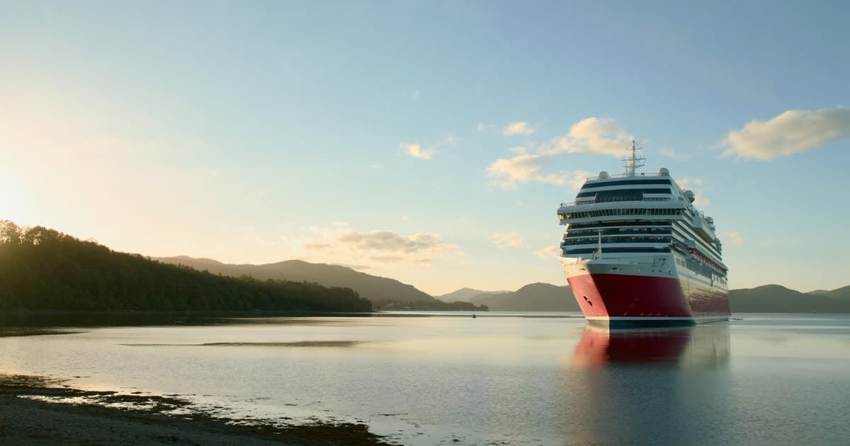 A cruise ship in harbour under a clear sky